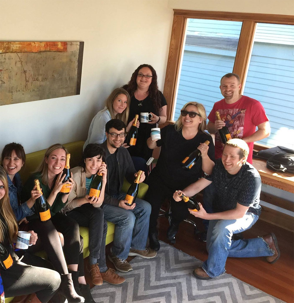 “Work hard, play hard,” one of Kathleen’s favorite mantras, is also a battlecry for her team at Imaginal Marketing. (She’s the one wearing the sunglasses, and no, it’s not due to the champagne). | Source: Kathleen Turpel
