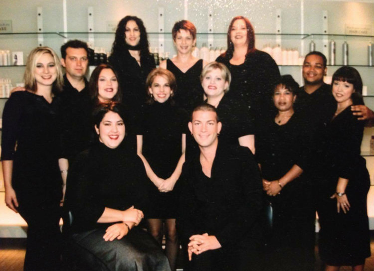 The original Prytania team in 2000, can you spot them? Heidi, center row, sporting her signature platinum blonde / red lip, Garrett Lemmons (center front), Chris Guidry (farthest male on the left), and Stacie Spiers (back row, curls). | Source: Heidi Downum-Fisher