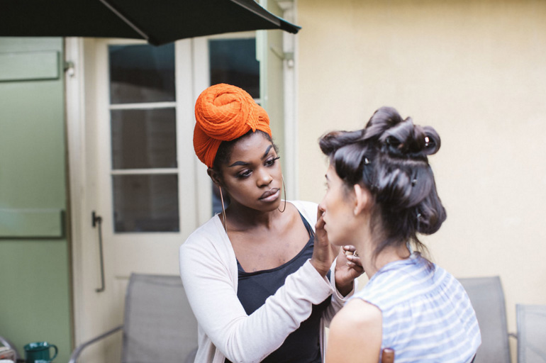 Claire Simmons, Makeup Artist & Skin Care Specialist at Paris Parker Prtytania and Canal Place, applies makeup to a model. Photo by Ollie Alexander | Source: Paris Parker